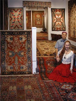 Paul and Eileen Jorgensen in surrounded by hand made oriental rugs.